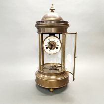 A French bronzed brass four panel cylinder mantle clock with porcelain dial and mercury pendulum, H.