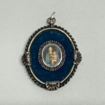 A hand painted miniature of the Madonna and child in a white metal (tested silver) frame, H. 9.5cm.