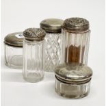 A group of silver topped dressing table bottles, tallest H. 11cm.