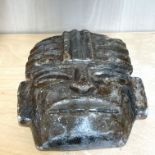 A carved hardstone Aztec tribal mask, H. 25cm.