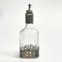 A Dutch silver mounted cut and etched glass bottle, H. 19cm.