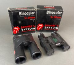 Four pairs of concert binoculars.