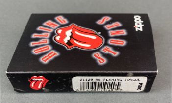 A 2006 flaming tongue zippo lighter, model no. 21129, boxed and unused.