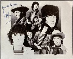 A signed Bill Wyman on a card.