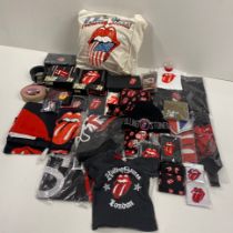 A large collection of Rolling Stones accessories, including belts, beanies, shoelaces, CD holders,