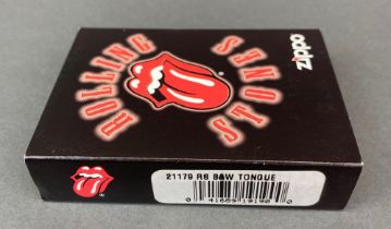 A 2007 candy apple red with black and white tongue Zippo lighter, model no. 21179. Boxed and