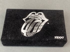 A 2002 40 licks limited edition Zippo lighter, no. 7286/10000, in presentation box and unused.