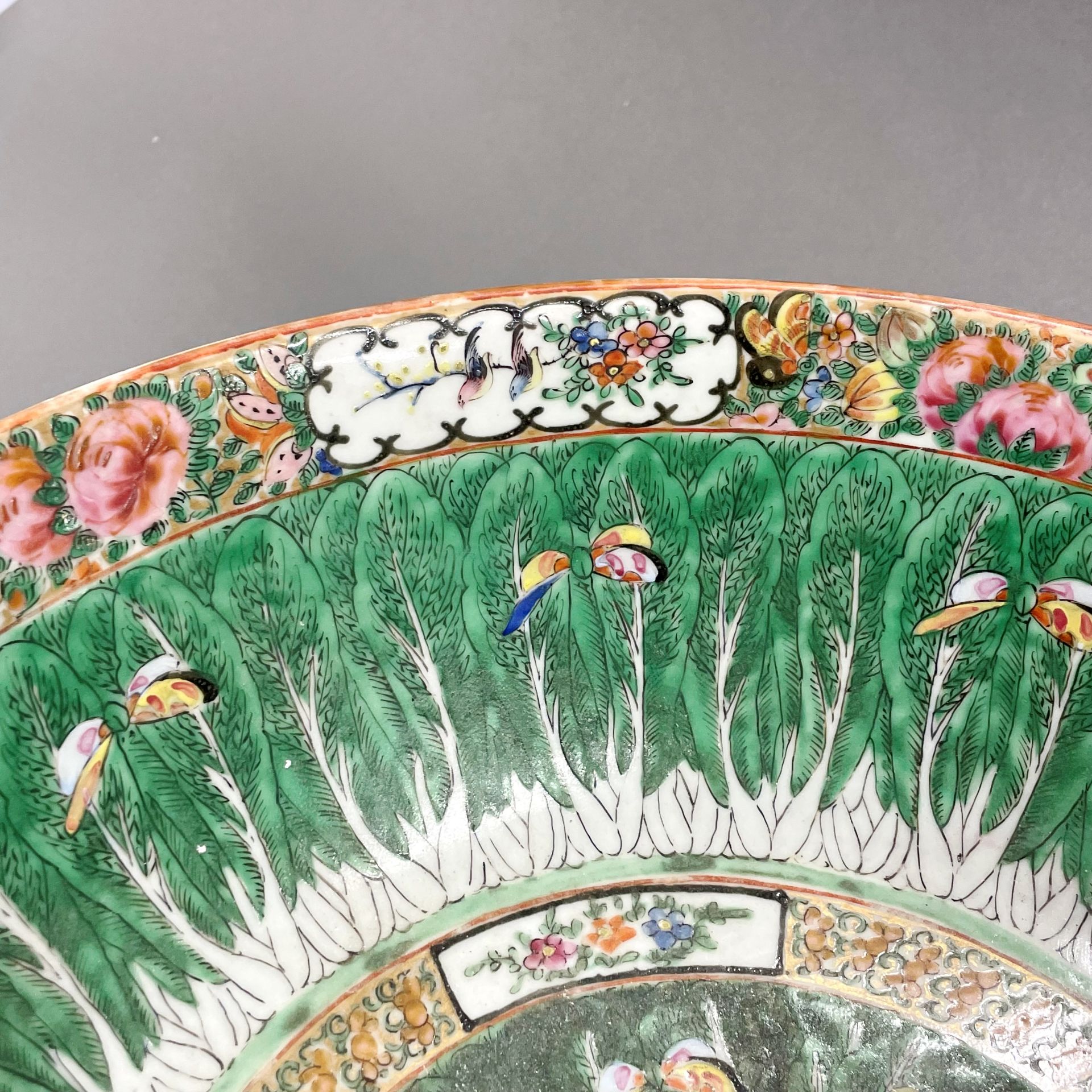 A large 19thC Chinese Canton enamelled bowl, Dia. 37cm, H. 15cm. Museum style restoration to rim. - Image 4 of 5