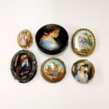 A group of hand painted porcelain brooches and a Russian hand painted box, box dia. 6cm.