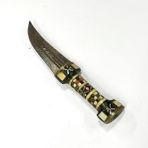 An Eastern horn, bone and brass handled dagger, L. 24cm.