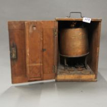 A cased copper burner, dated 1913, case H. 33cm.
