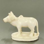 An 18th / 19th century Indian carved white marble sacred bull figure, L. 16cm, H. 12cm.