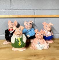 A set of five NatWest bank pigs.