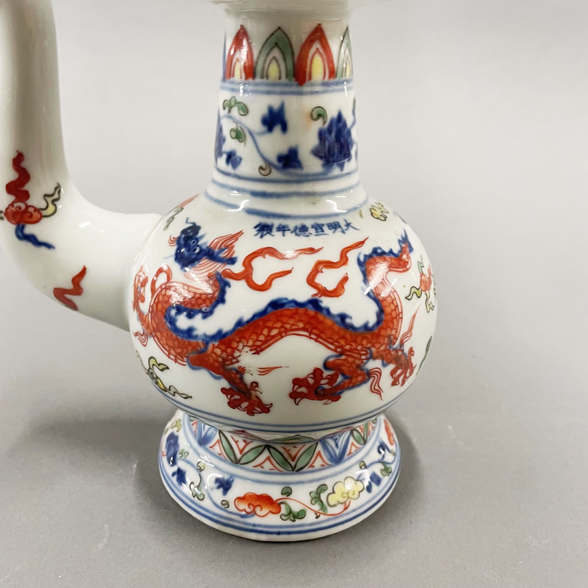 An unusual hand painted porcelain oil pourer, H. 20cm. - Image 2 of 4