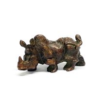 A small heavy Chinese cast bronze figure of a rhinoceros, L. 8cm, H. 4cm.