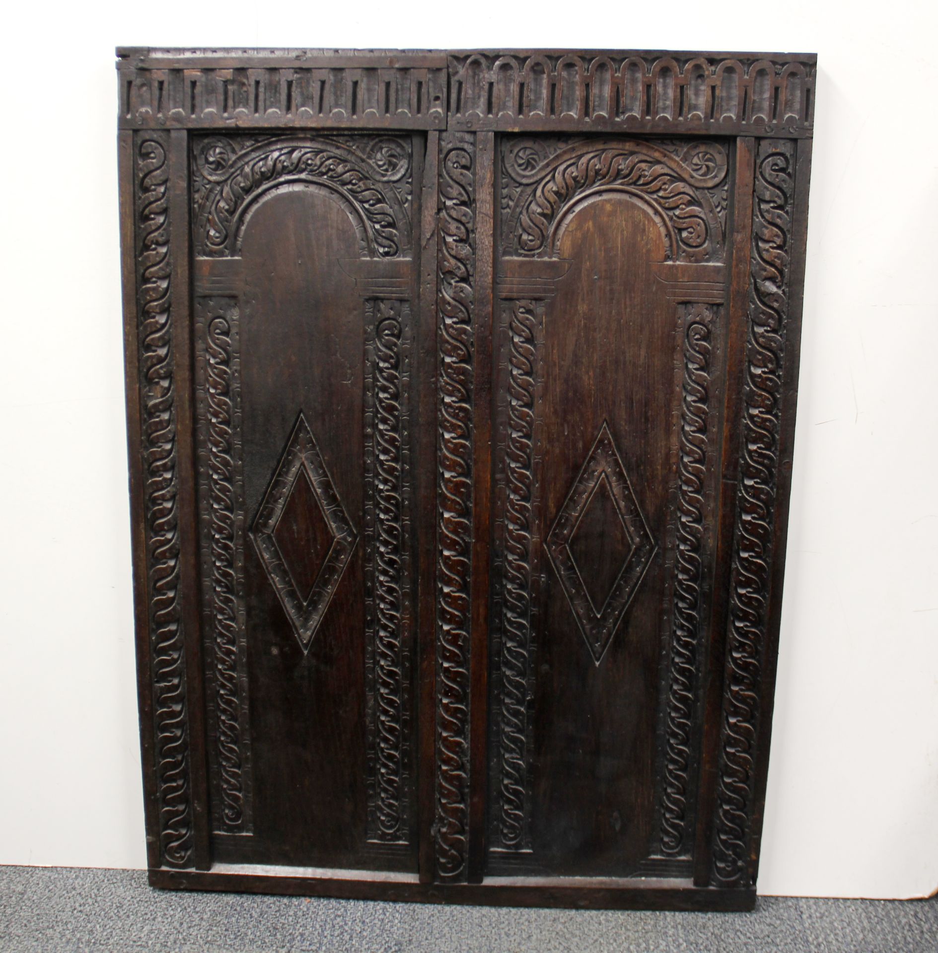 A large 17thC carved oak panel believed to be from a church in Royston, Hertfordshire, 78 x 104cm.