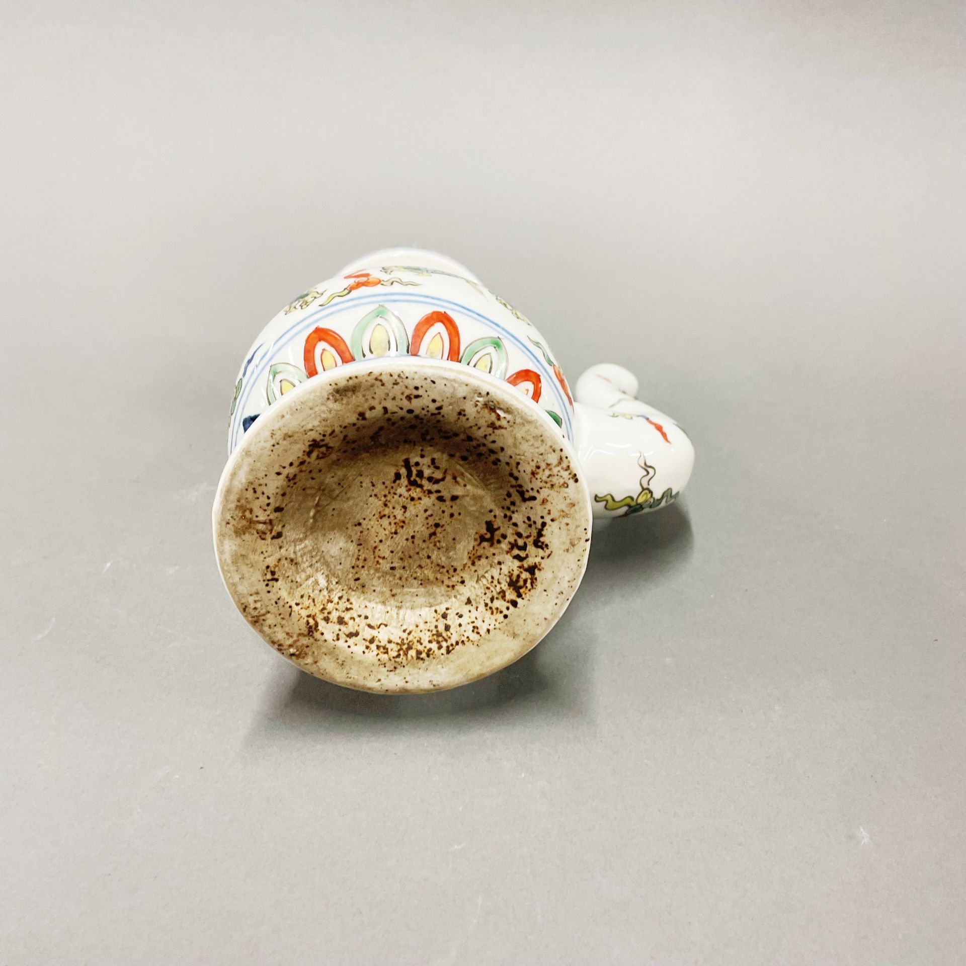 An unusual hand painted porcelain oil pourer, H. 20cm. - Image 3 of 4