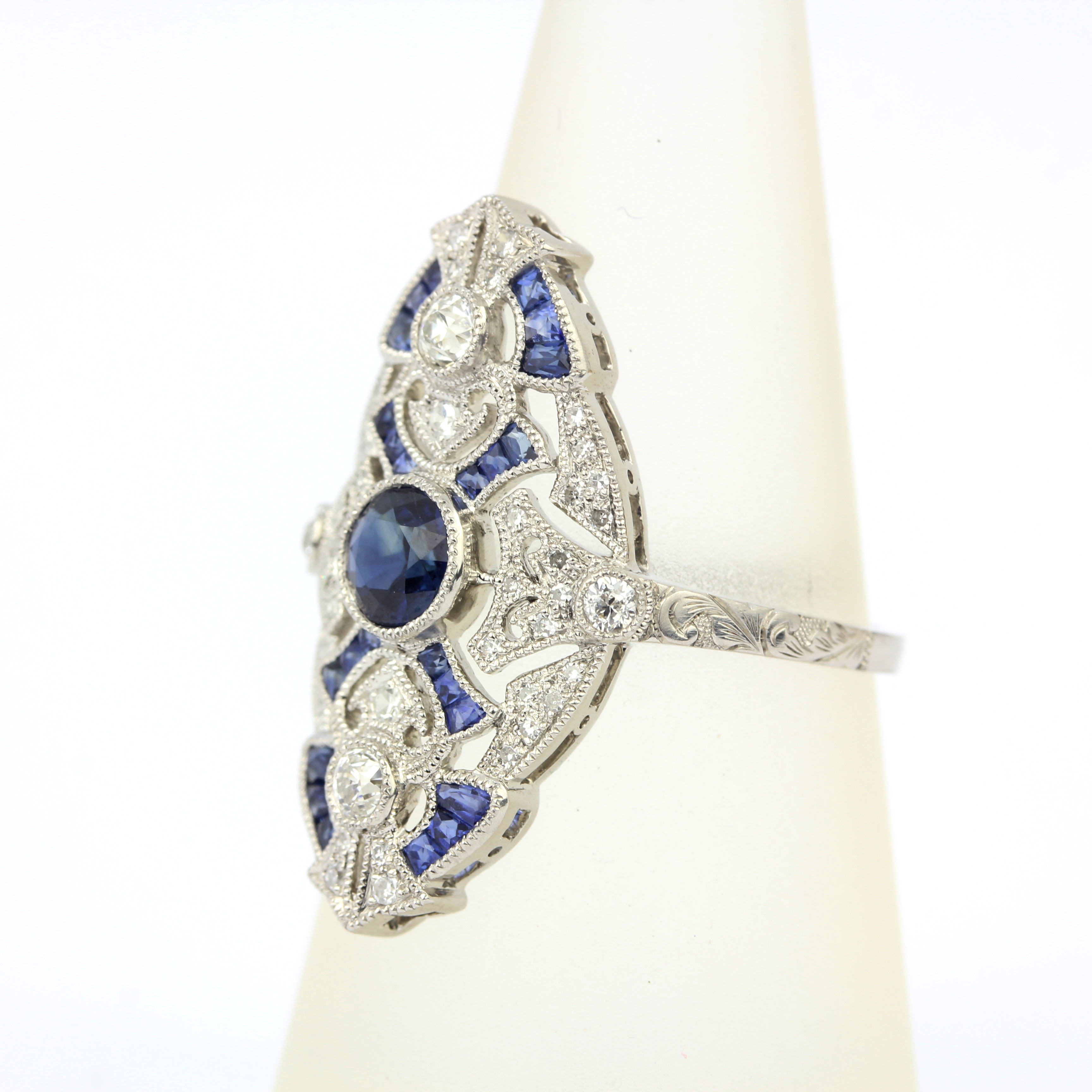 An 850 platinum ring set with a Royal blue sapphire and brilliant cut diamonds, centres sapphire 0. - Image 2 of 3