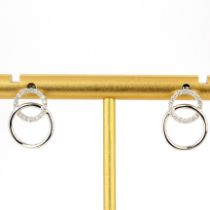 A pair of 18ct white gold diamond set earrings, L. 1.2cm.