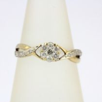 A 9ct yellow gold diamond set cluster ring with diamond set shoulders, (N).