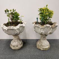 A pair of antique concrete octagonal based planters, H. 51cm Dia. 46cm.