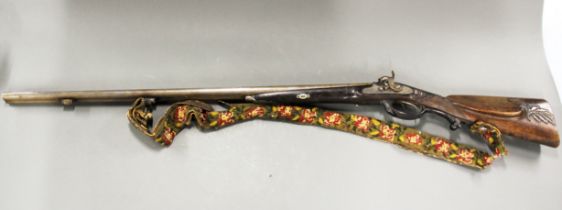 An early rifle, L. 120cm.