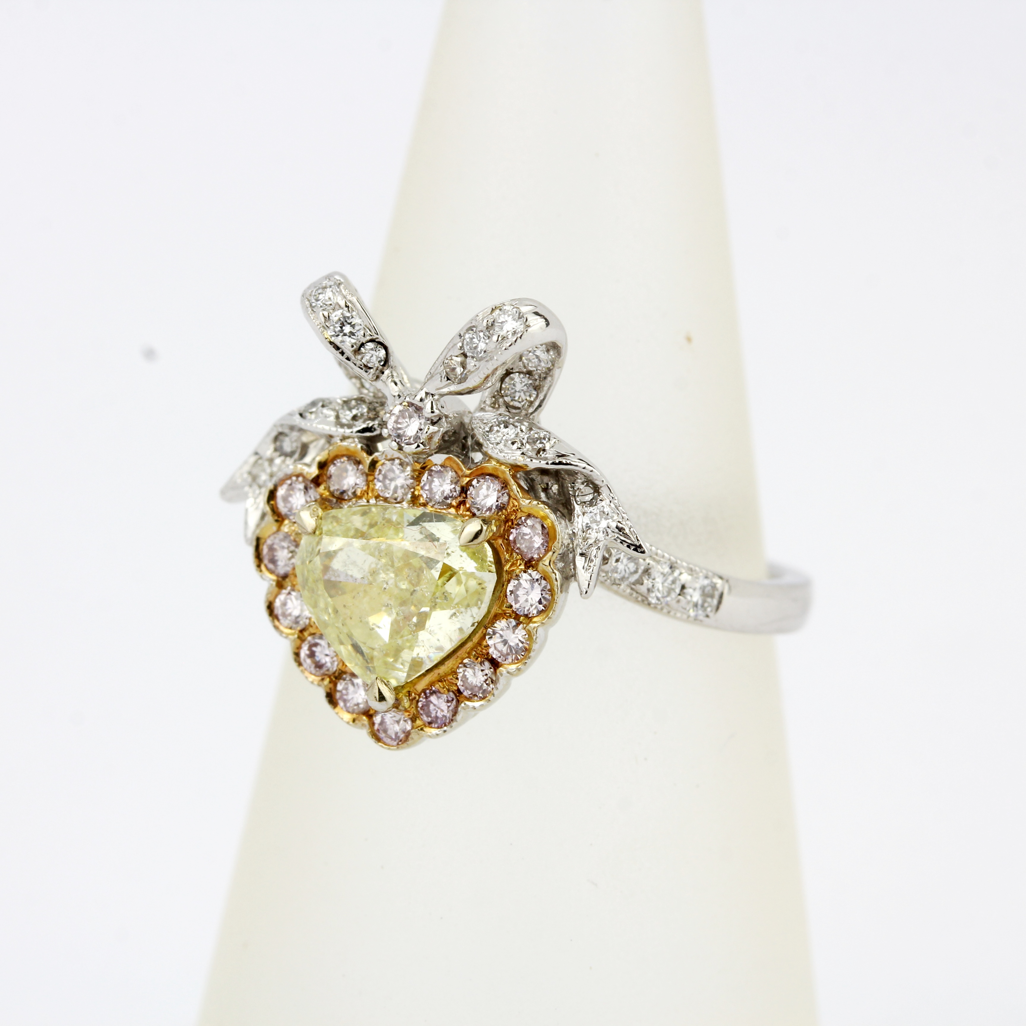 An 18ct white gold ring set with a heart brilliant cut fancy yellow diamond, surrounded by pink - Image 5 of 5