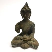 An Indian bronze figure of a seated Buddha, H. 23cm.