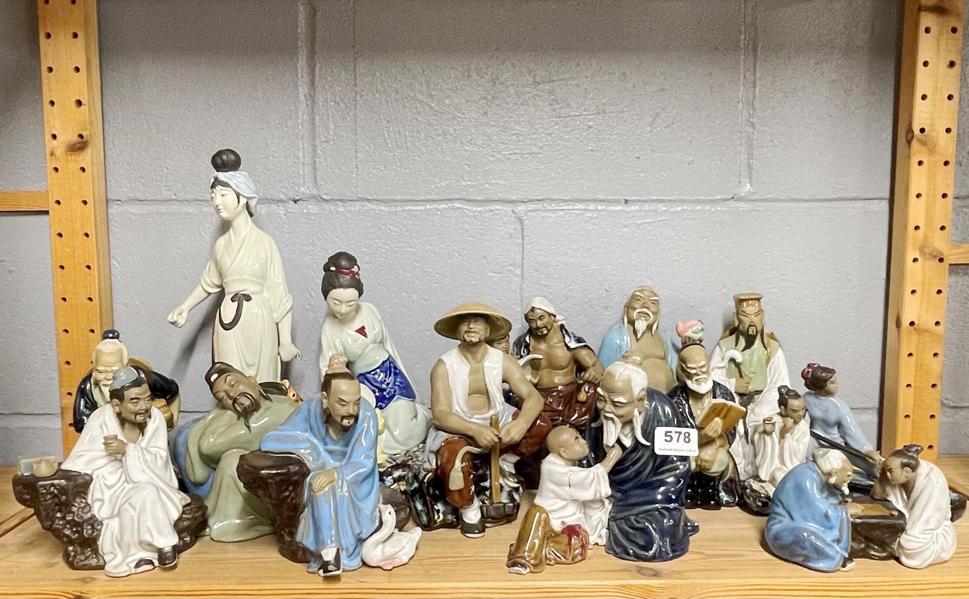 A collection of Chinese porcelain figurines, tallest H. 32cm.