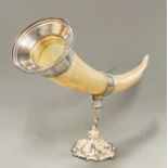 A large silver plate mounted cattle horn, L. 63cm, H. 37cm.