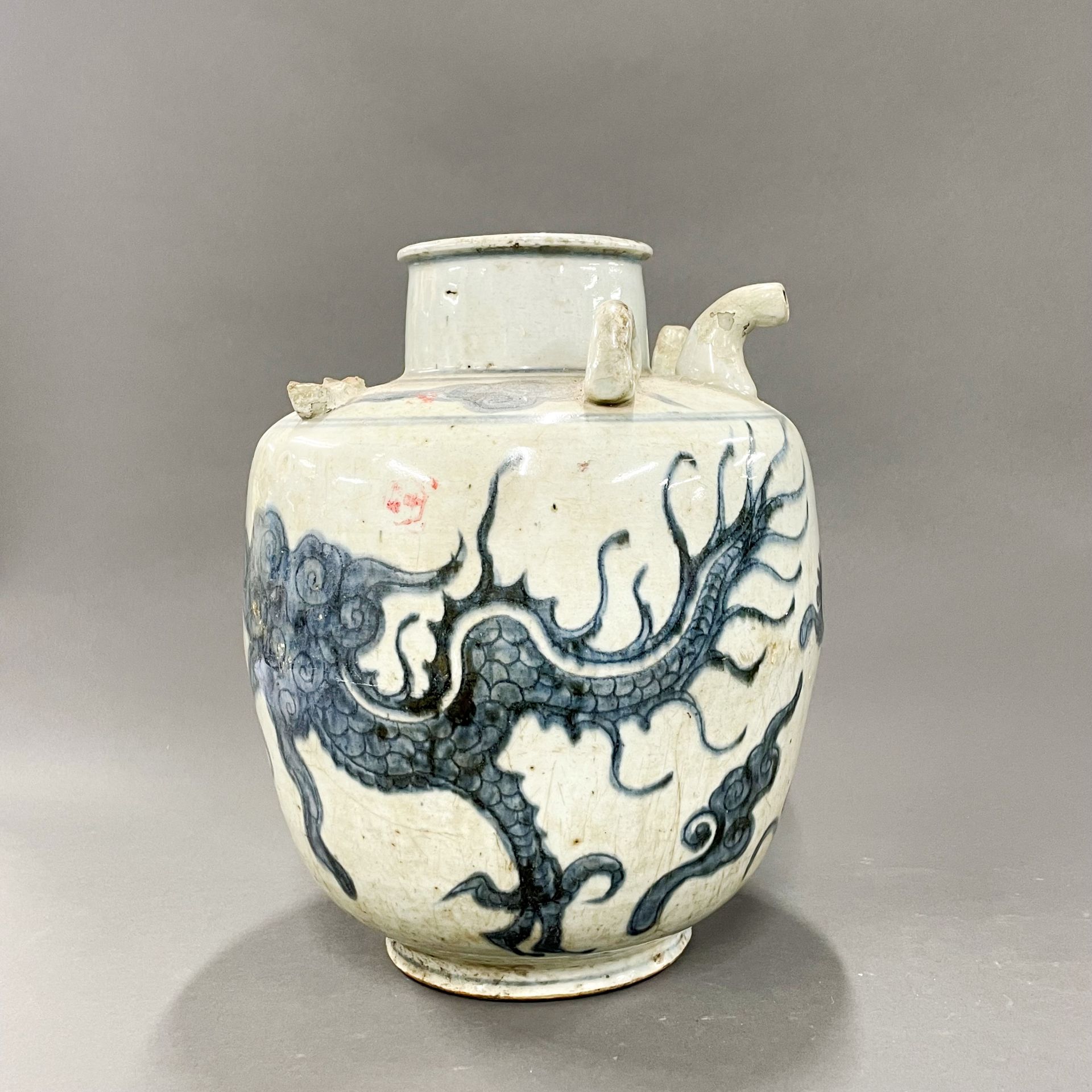 A large early Chinese hand painted provincial porcelain wine jar, H. 31cm. Some restoration and