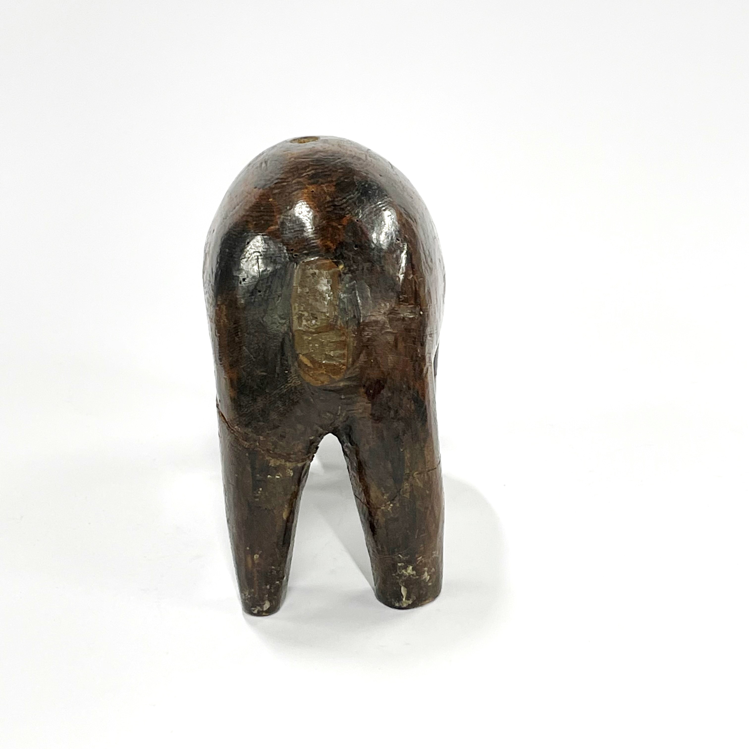 A 19th / early 20th century African tribal carved wooden bull figure, L. 18cm, H. 12cm. Some - Image 4 of 4