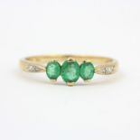 A 9ct yellow gold emerald and diamond set ring, (S).
