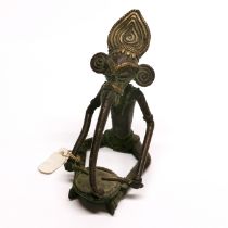 An Indian bronze figure of Ganesh playing a drum, H. 11cm.