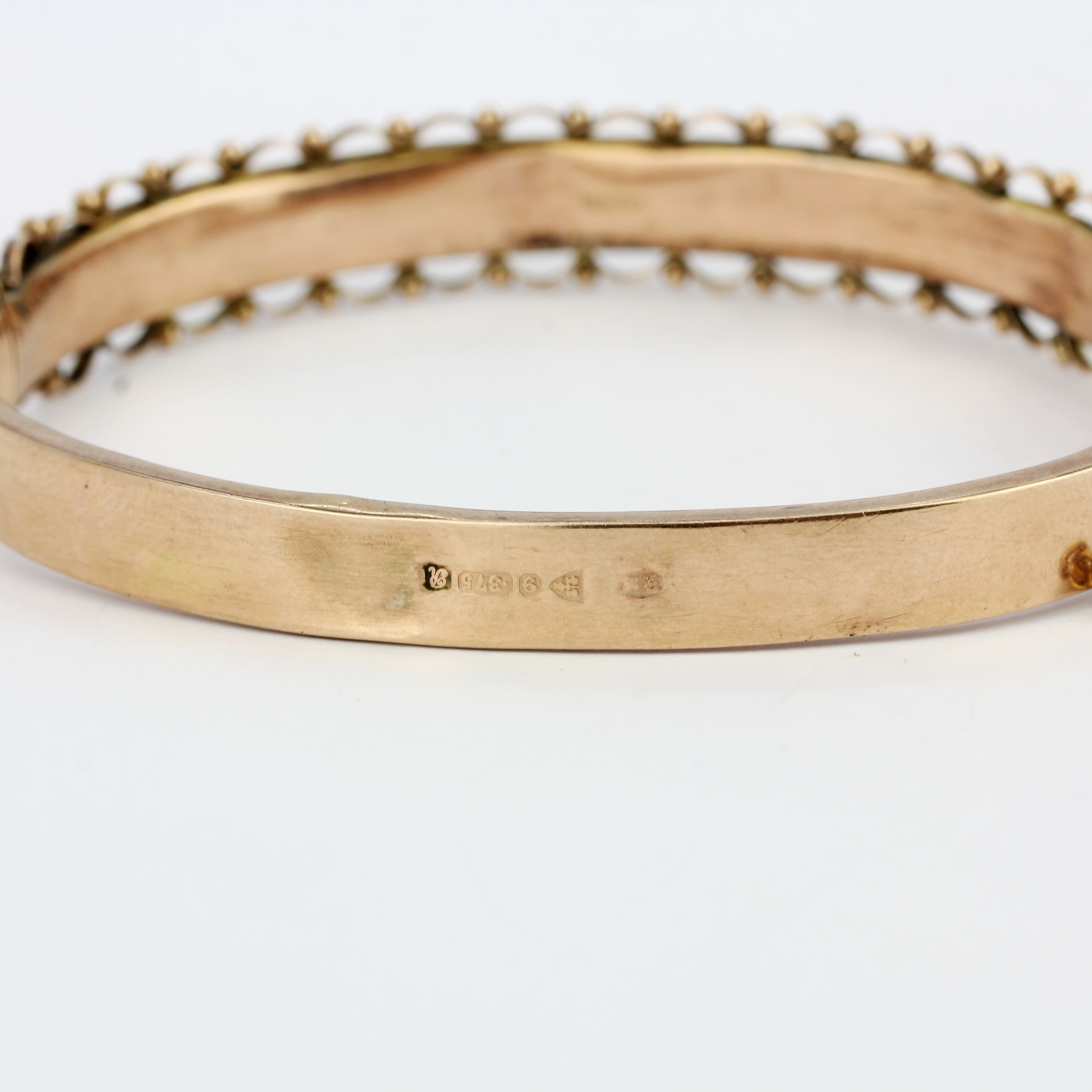 A hallmarked 9ct rose gold bangle, internal size 5.5 x 4.5cm. Some dents. - Image 3 of 3