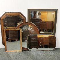 A group of five wall mirrors, mostly oak framed, largest 85 x 60cm.