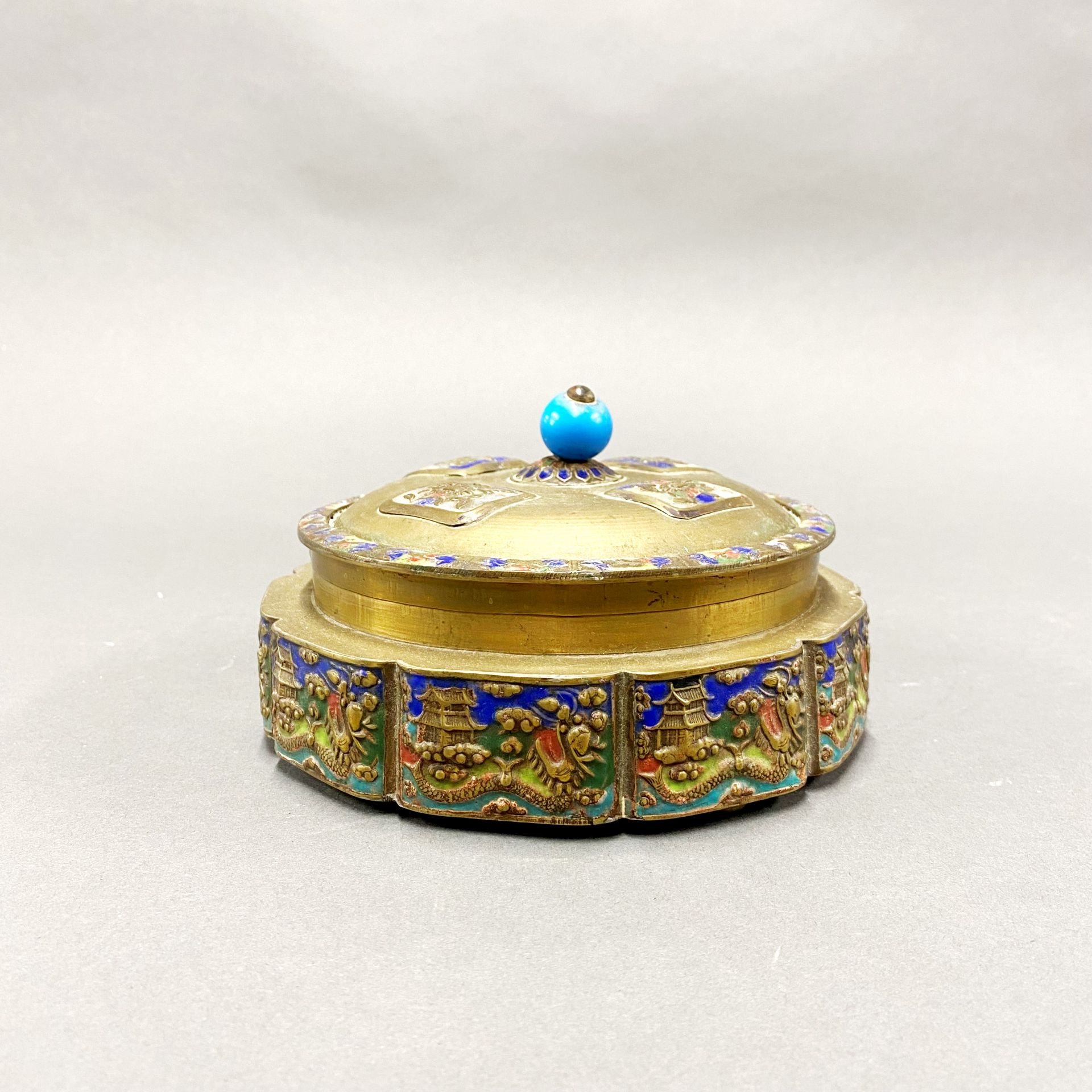 An early 20thC Chinese enamelled brass box and cover, Dia. 17cm.