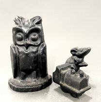 Three cast iron items, tallest H. 14cm.