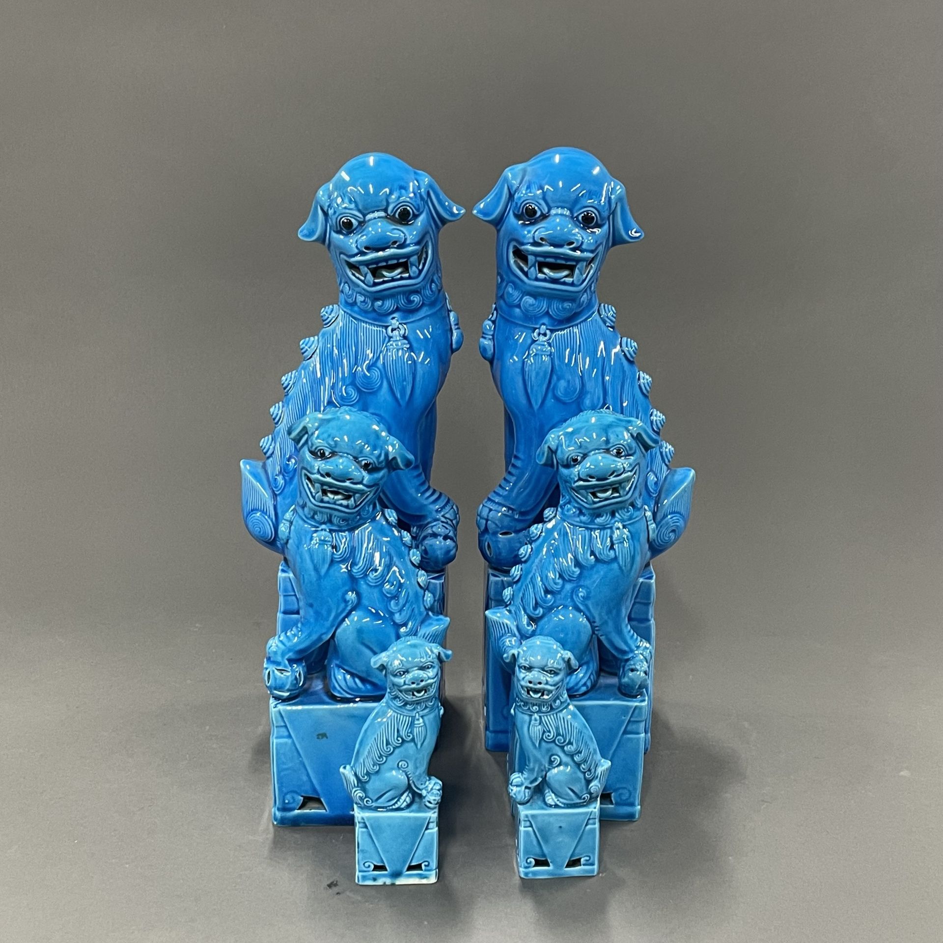 Three pairs of Chinese porcelain foo dogs, tallest H. 33cm.