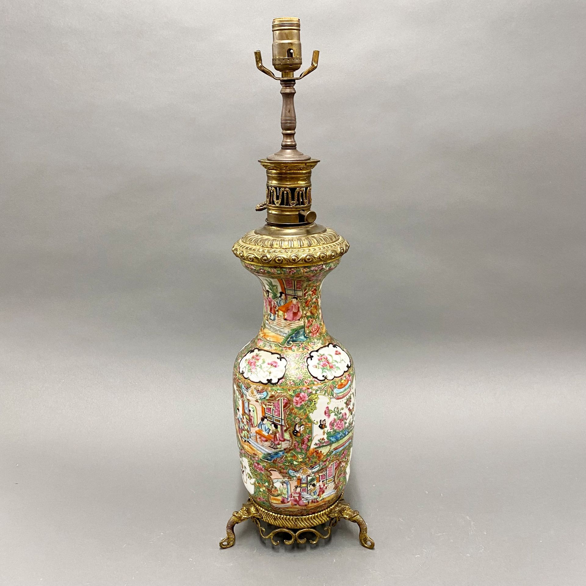 A 19thC Chinese famille rose porcelain vase, mounted c. 1900 as a table lamp. (A/F), H. 67cm.