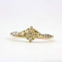 A 9ct yellow gold ring set with fancy yellow diamonds and diamond set shoulders, (O).