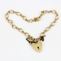 A hallmarked 9ct yellow gold heart padlock bracelet.