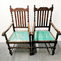 A pair of carved oak carver chairs with barley twist backs, H. 111cm.