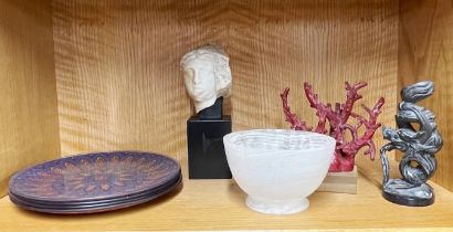 A polished stone bowl, a small coral tree, a carved soapstone dragon, four vintage glass plates