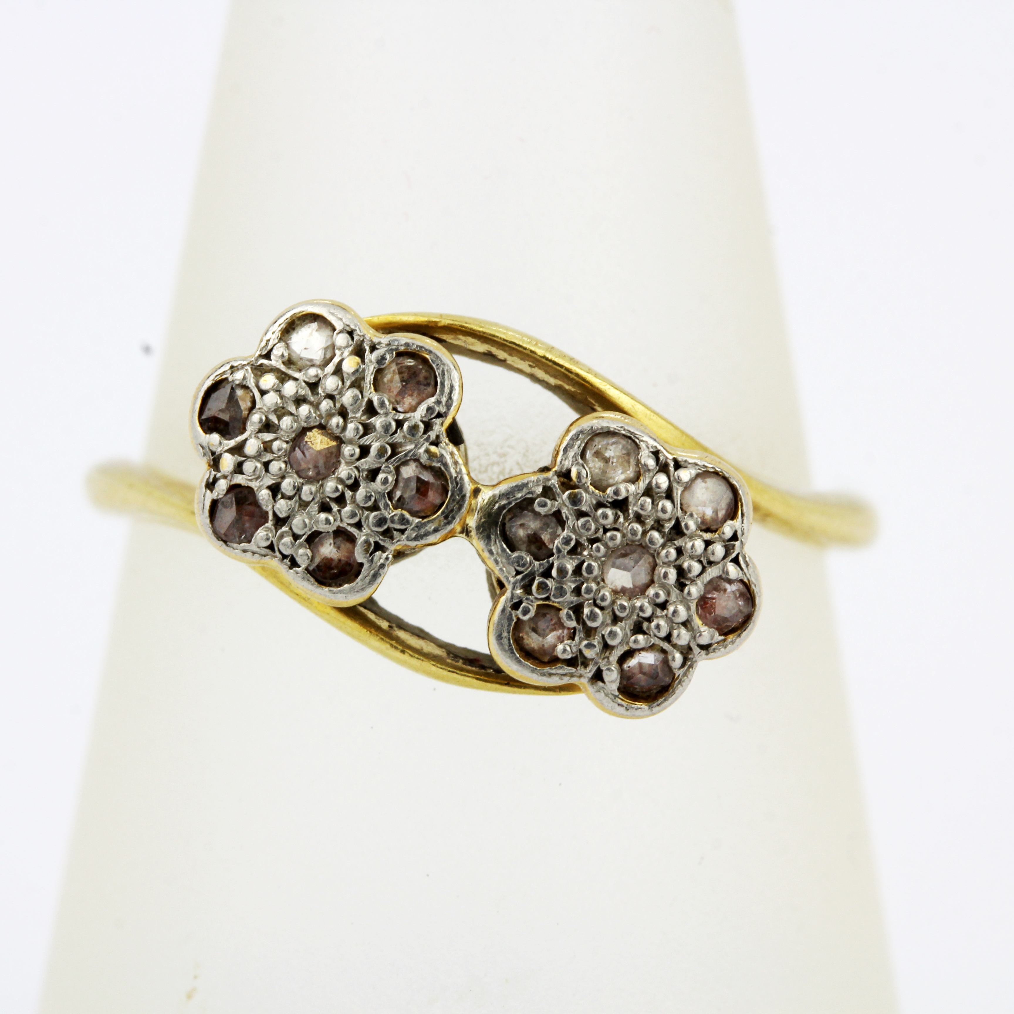 An 18ct gold and platinum diamond set crossover ring, (P.5). - Image 3 of 3