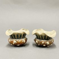 A pair of early Royal Doulton bowls with sea shell decoration, Dia. 10cm, H. 6.5cm (A/F).