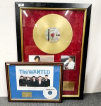 A framed Michael Jackson Thriller gold record with plaque and pictures, and a further CD for the