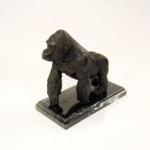 A bronze figure of a gorilla on a black marble base, H. 18cm.