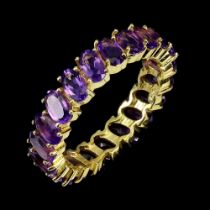 A gold on 925 silver full eternity ring set with oval cut amethysts, (O).