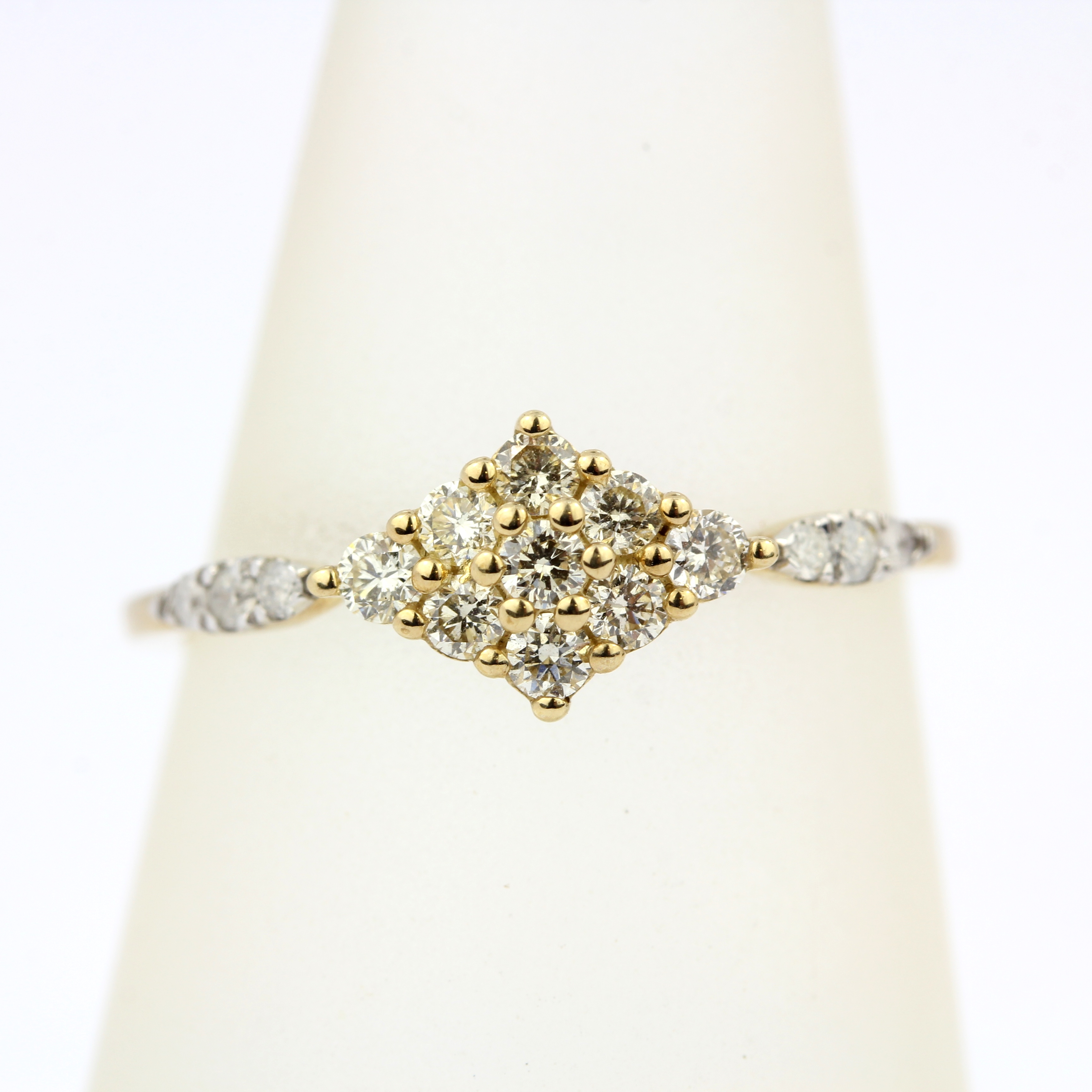A 9ct yellow gold ring set with fancy yellow diamonds and diamond set shoulders, (O). - Image 3 of 3